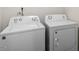 Bright laundry area featuring a white washer and dryer set, perfect for convenient chores at 30 Dowdy Ct, Youngsville, NC 27596