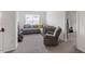 Inviting living area with comfortable seating, carpet, and neutral paint at 30 Dowdy Ct, Youngsville, NC 27596