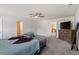 Large main bedroom boasts carpet floors, neutral walls, and a relaxing seating area at 30 Dowdy Ct, Youngsville, NC 27596
