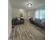 Open living space offering contemporary furnishings and durable wood-look flooring at 307 S Smithfield Rd, Knightdale, NC 27545