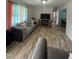 Bright living room with updated flooring, comfortable seating, and modern decor at 307 S Smithfield Rd, Knightdale, NC 27545