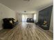 Spacious living room with laminate flooring, modern fireplace, and ample seating at 307 S Smithfield Rd, Knightdale, NC 27545