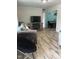 Cozy living area showcasing wood-look floors and access to a dining area at 307 S Smithfield Rd, Knightdale, NC 27545