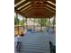 Covered porch features an open design and overlooks the backyard at 307 S Smithfield Rd, Knightdale, NC 27545