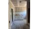 Bathroom featuring a double sink vanity with white shaker cabinets and a door leading to the toilet at 329 Green Pines Estates Dr, Kenly, NC 27542
