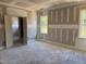 Bedroom featuring white trim, natural light from windows, and doors leading to the bathroom at 329 Green Pines Estates Dr, Kenly, NC 27542
