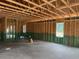 Large unfinished room with exposed wood framing and high ceilings, ready for customization and personalization at 329 Green Pines Estates Dr, Kenly, NC 27542