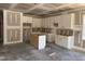 Kitchen featuring shaker style cabinets with an island and a window offering natural light at 329 Green Pines Estates Dr, Kenly, NC 27542