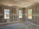 Room with three double hung windows with white trim and natural light with wainscoting under the windows at 329 Green Pines Estates Dr, Kenly, NC 27542