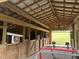 Inside the barn, find stalls, sturdy wood framing, and a metal roof, ideal for livestock at 342 Mcleod Rd, Broadway, NC 27505