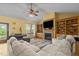 Warm and inviting living room with a fireplace, custom bookshelves, and a beautiful view at 342 Mcleod Rd, Broadway, NC 27505