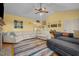 Open-concept living room with vaulted ceilings, plush seating, and stylish decor at 342 Mcleod Rd, Broadway, NC 27505
