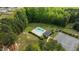 Aerial view showcases the community pool, cabana, parking lot, and landscaping at 35 Vauxhall Ct, Youngsville, NC 27596