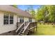 Large wooden back deck on house with an ample backyard area at 35 Vauxhall Ct, Youngsville, NC 27596