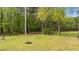 The large backyard offers a peaceful setting with a brick firepit at 35 Vauxhall Ct, Youngsville, NC 27596