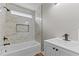 Modern bathroom with a white vanity, marble tile, and sleek fixtures at 35 Vauxhall Ct, Youngsville, NC 27596