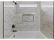 Beautifully renovated bathroom showcasing marble tiling and contemporary shower fixtures at 35 Vauxhall Ct, Youngsville, NC 27596
