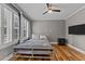 Bedroom filled with natural light and stylish wood-look flooring at 35 Vauxhall Ct, Youngsville, NC 27596
