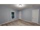 Cozy bedroom with new floors, fresh paint, a large window, and ample closet space at 3610 Hawkins Ave, Sanford, NC 27330