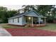 Charming single-story home with a cozy covered front porch and manicured lawn at 3610 Hawkins Ave, Sanford, NC 27330