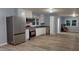 Modern kitchen featuring stainless steel appliances, granite countertops, and wood floors at 3610 Hawkins Ave, Sanford, NC 27330