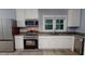 Modern kitchen featuring stainless steel appliances, granite countertops, and ample storage at 3610 Hawkins Ave, Sanford, NC 27330