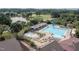 Aerial view of community pool, including water slide, baby pool and seating areas with umbrellas at 3827 Heritage Spring Circle Cir, Wake Forest, NC 27587