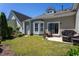 Lawn with patio area and seating, perfect for outdoor living and entertaining at 3827 Heritage Spring Circle Cir, Wake Forest, NC 27587
