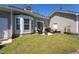 Outdoor patio with a grill, outdoor seating, and green lawn at 3827 Heritage Spring Circle Cir, Wake Forest, NC 27587