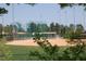 Well-maintained baseball field with dugouts, green fences, and lush trees in the background at 3827 Heritage Spring Circle Cir, Wake Forest, NC 27587