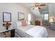 Cozy bedroom featuring sloped ceiling, ceiling fan, and natural light at 3827 Heritage Spring Circle Cir, Wake Forest, NC 27587