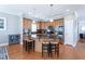 Large kitchen with hardwood floors, granite countertops and center island with seating at 3827 Heritage Spring Circle Cir, Wake Forest, NC 27587