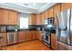 Well-equipped kitchen with stainless steel appliances, granite countertops, and ample cabinet space at 3827 Heritage Spring Circle Cir, Wake Forest, NC 27587