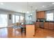 Bright eat-in kitchen with a large island, dining area, and hardwood floors at 3827 Heritage Spring Circle Cir, Wake Forest, NC 27587