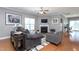 Cozy living space with a fireplace, hardwood floors, and comfortable seating at 3827 Heritage Spring Circle Cir, Wake Forest, NC 27587
