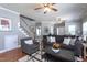 Comfortable living room with a staircase, hardwood floors, and stylish furnishings at 3827 Heritage Spring Circle Cir, Wake Forest, NC 27587