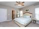 Bright main bedroom featuring a ceiling fan, windows and coordinating furniture at 3827 Heritage Spring Circle Cir, Wake Forest, NC 27587