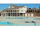 Stunning community pool with sundeck, sun loungers and covered outdoor seating at 3827 Heritage Spring Circle Cir, Wake Forest, NC 27587