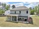 Spacious backyard featuring a screened in porch and an outdoor patio area at 3901 Bluffwind Dr, Raleigh, NC 27603