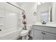 Bathroom featuring a shower-tub combo and vanity with modern fixtures at 3901 Bluffwind Dr, Raleigh, NC 27603