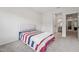 Bedroom featuring neutral walls, carpet, and bathroom doorway at 3901 Bluffwind Dr, Raleigh, NC 27603