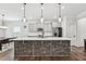 Kitchen with grey cabinets, white subway tile backsplash, stainless appliances, and a large kitchen island at 3901 Bluffwind Dr, Raleigh, NC 27603