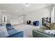 Upstairs living room with plush carpeting and eclectic furnishings bathed in natural light at 3901 Bluffwind Dr, Raleigh, NC 27603