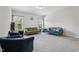 Open living space with neutral carpeting, perfect for relaxation and entertainment at 3901 Bluffwind Dr, Raleigh, NC 27603