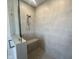 Tiled shower featuring a built-in bench, sleek fixtures, and glass enclosure at 40 Wabash St, Pittsboro, NC 27312