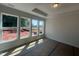 Bright bedroom featuring large windows overlooking a spacious backyard with natural light at 40 Wabash St, Pittsboro, NC 27312