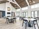 Community room with ample seating, tables, fireplace, tall ceilings, and modern lighting at 40 Wabash St, Pittsboro, NC 27312