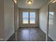 Empty room with a hardwood floor and lots of natural light at 40 Wabash St, Pittsboro, NC 27312
