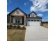 Charming home featuring stone accents, a two-car garage, and well-maintained landscaping at 40 Wabash St, Pittsboro, NC 27312