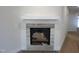 Modern fireplace with gray tile surround and a white mantel offers a cozy focal point at 40 Wabash St, Pittsboro, NC 27312